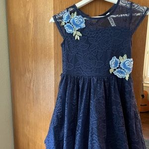 Girls Easter dress with blue lace and flowers.